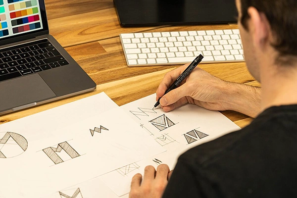 Designer sketching logos